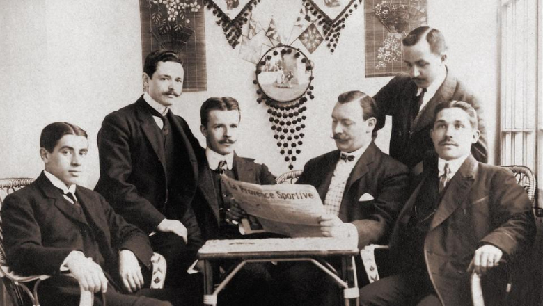 Joan Gamper (center, reading newspaper) founded the club following a magazine advertisement